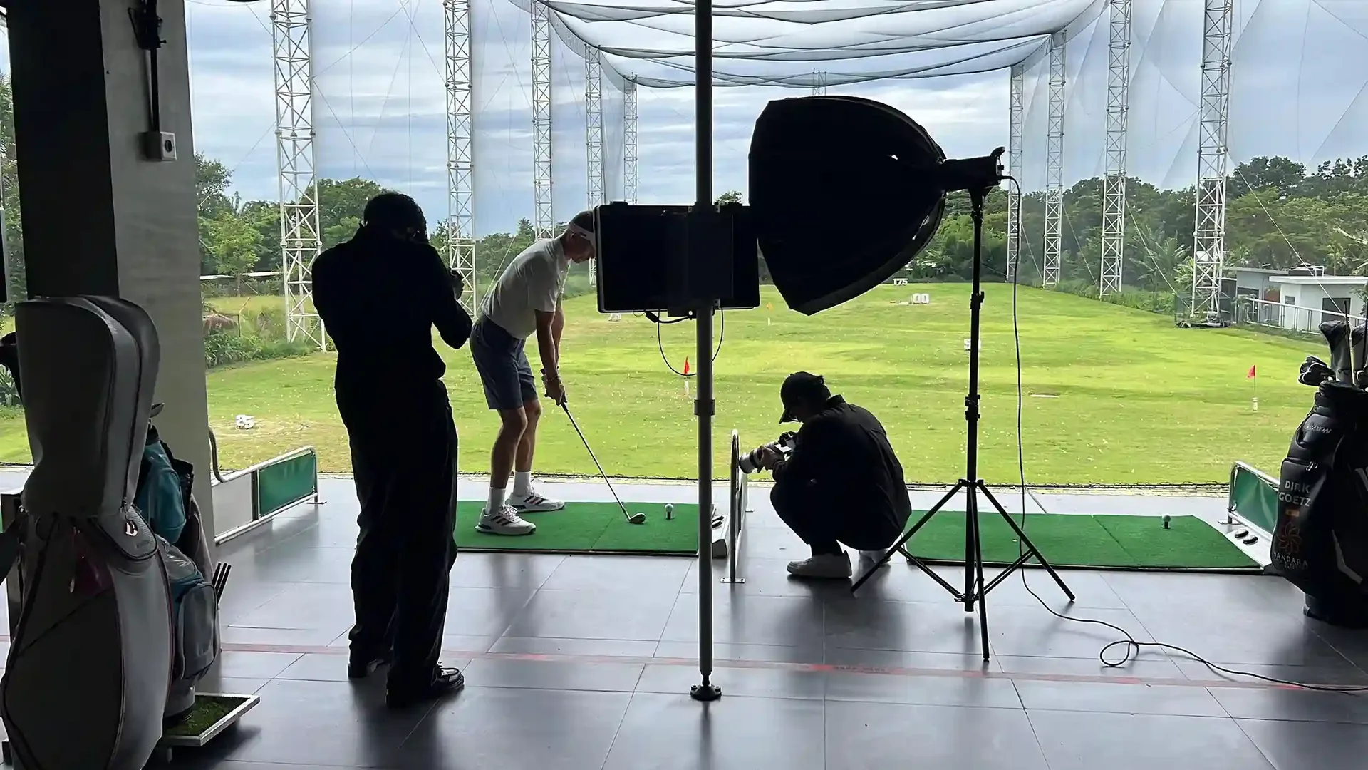Film crew with camera and lighting rig working on set in Bali