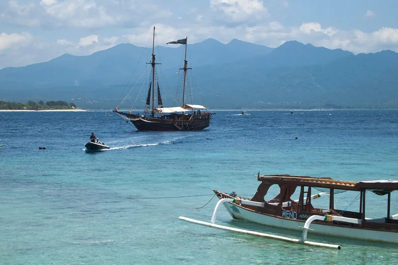 Lombok coastline and Mount Rinjani seen across the water from Gili Meno